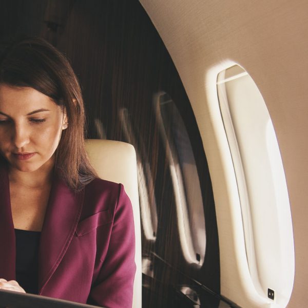 Woman using ad hoc private jet charter